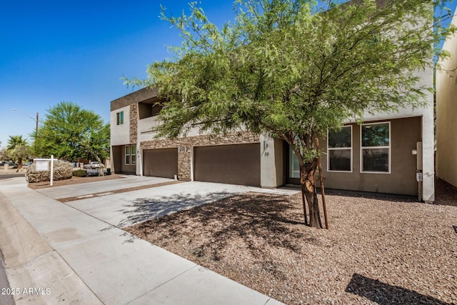 2000 N 36th St Unit 30, Phoenix, AZ 85008 - view of front of home with concrete driveway, an attached garage, and stucco siding