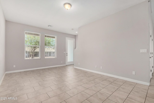 2000 N 36th St Unit 30, Phoenix, AZ 85008 - spare room with baseboards and light tile patterned flooring