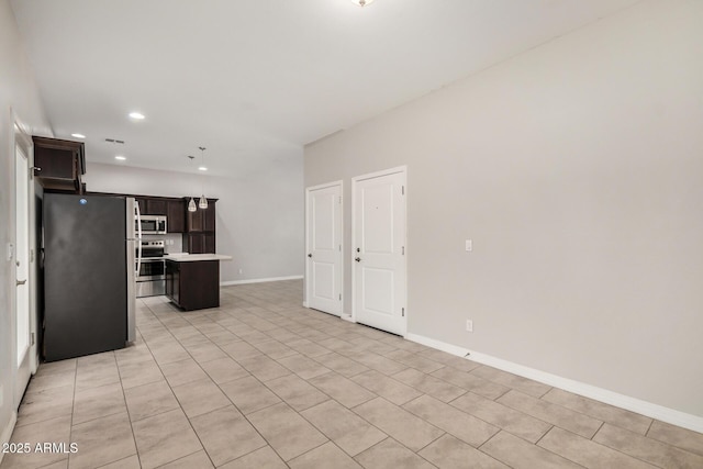 2000 N 36th St Unit 30, Phoenix, AZ 85008 - unfurnished living room with light tile patterned flooring and recessed lighting