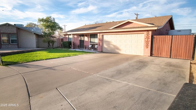 single story home with a garage and a front yard