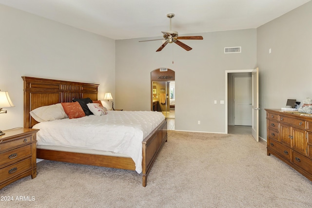 bedroom featuring ceiling fan and light colored carpet