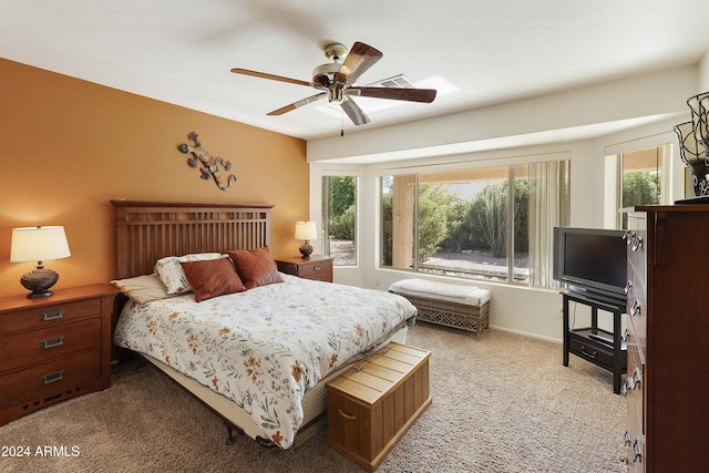 bedroom featuring ceiling fan and light colored carpet