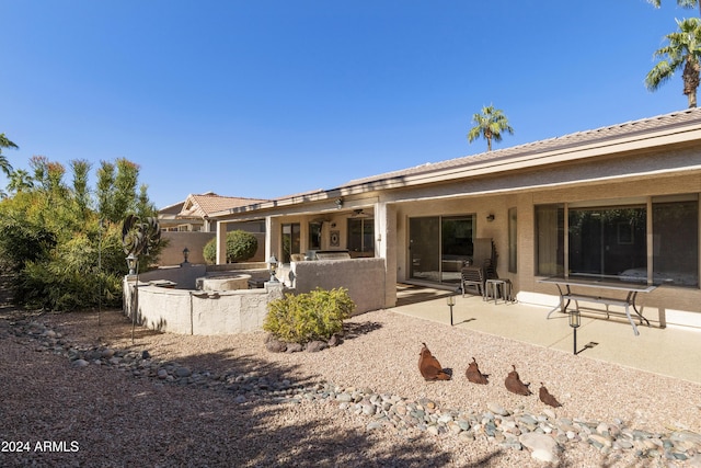 back of property featuring a patio area and area for grilling