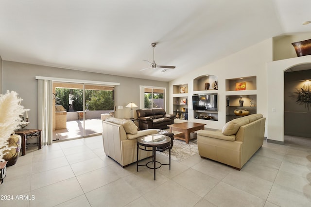 living room with ceiling fan, light tile patterned floors, vaulted ceiling, and built in features