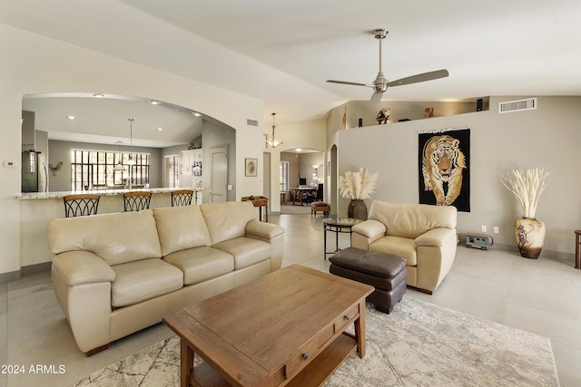 living room with vaulted ceiling and ceiling fan