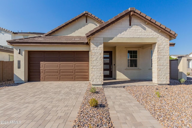 21354 E Sparrow Dr, Queen Creek, AZ 85142 - view of front of house featuring decorative driveway, a tile roof, stucco siding, and a garage