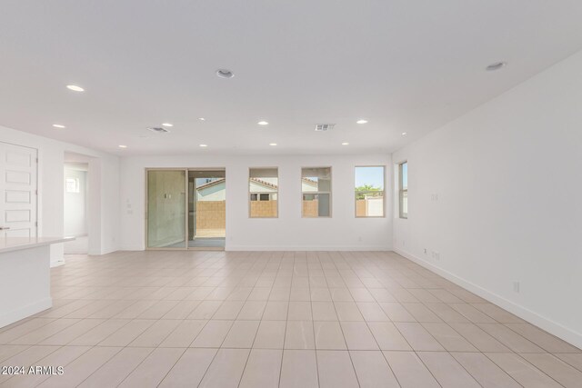 spare room featuring light tile patterned floors