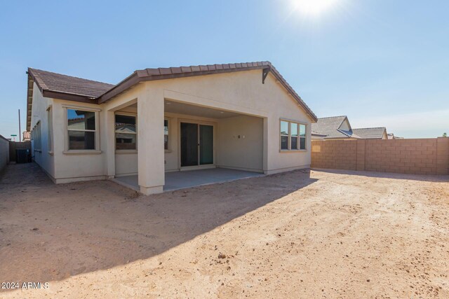 21354 E Sparrow Dr, Queen Creek, AZ 85142 - back of house featuring stucco siding, fence private yard, and a patio area