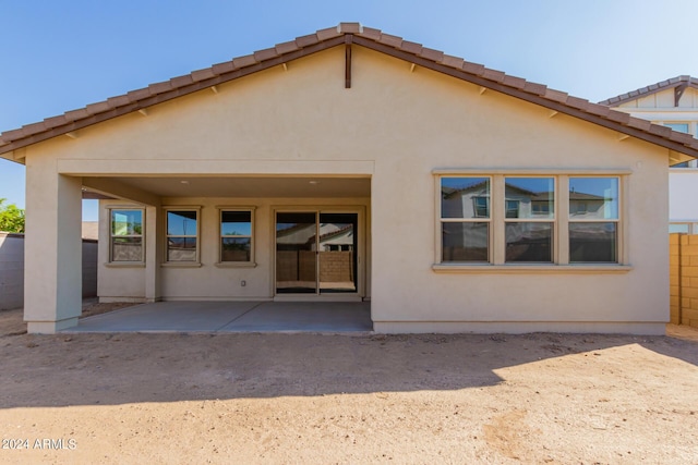 21354 E Sparrow Dr, Queen Creek, AZ 85142 - back of property featuring stucco siding, fence, and a patio area
