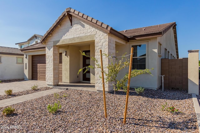 21354 E Sparrow Dr, Queen Creek, AZ 85142 - view of front of home featuring driveway, a garage, and stucco siding
