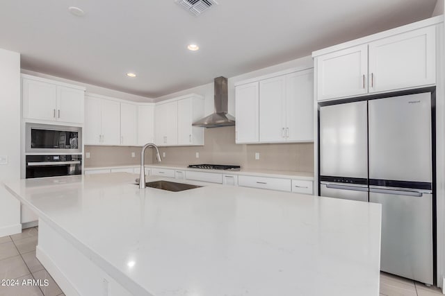 21354 E Sparrow Dr, Queen Creek, AZ 85142 - kitchen with light tile patterned flooring, a sink, wall chimney exhaust hood, stainless steel appliances, and visible vents