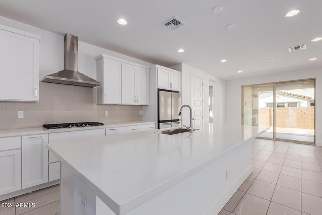 21354 E Sparrow Dr, Queen Creek, AZ 85142 - kitchen with visible vents, a sink, wall chimney exhaust hood, and gas stovetop