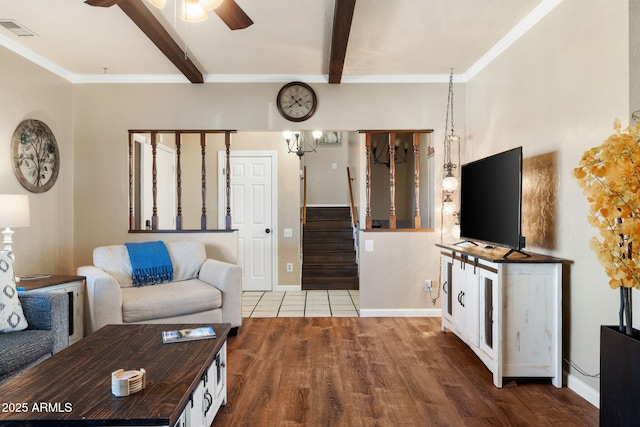 living room featuring crown molding, beam ceiling, wood-type flooring, and ceiling fan