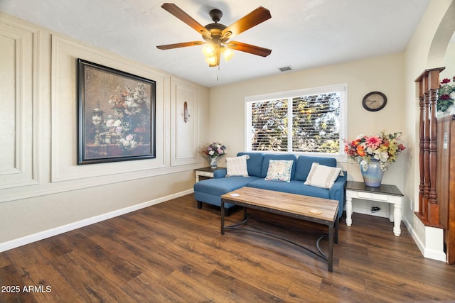 sitting room featuring ceiling fan and dark hardwood / wood-style floors