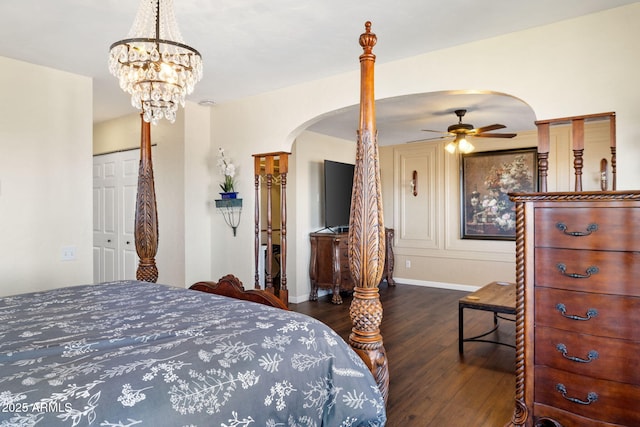 bedroom with dark wood-type flooring and a closet