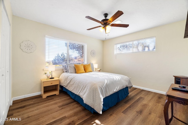 bedroom featuring ceiling fan and dark hardwood / wood-style flooring