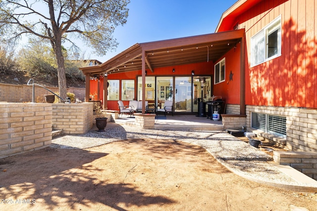 rear view of house with a patio