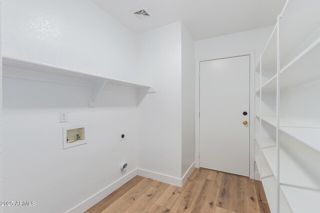 3064 E Michelle Way, Gilbert, AZ 85234 - laundry room featuring hookup for an electric dryer, light wood-style floors, and hookup for a washing machine
