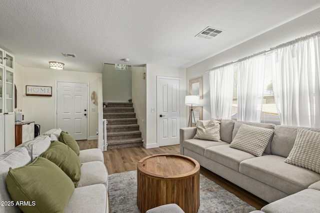 3064 E Michelle Way, Gilbert, AZ 85234 - living room with wood finished floors, stairs, and a textured ceiling