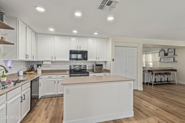 3064 E Michelle Way, Gilbert, AZ 85234 - kitchen featuring open shelves, black appliances, white cabinets, light wood-style flooring, and recessed lighting