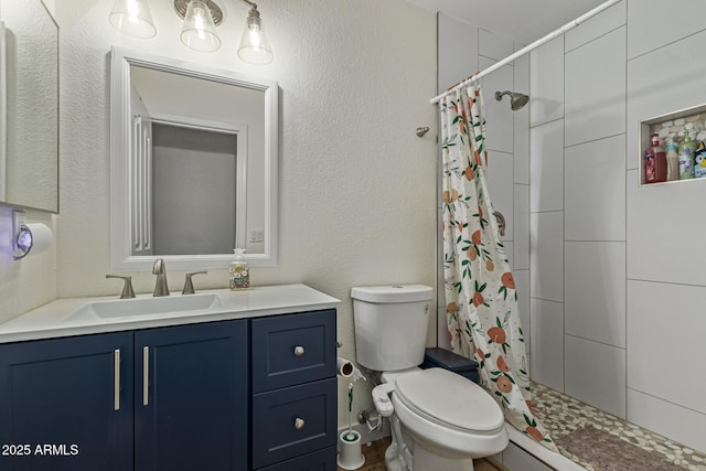 3064 E Michelle Way, Gilbert, AZ 85234 - bathroom featuring vanity, tiled shower, and a textured wall