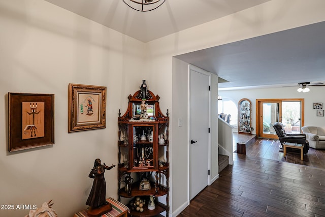 corridor featuring stairway and dark wood finished floors