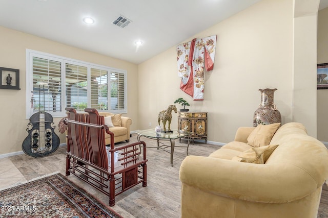 living room with wood finished floors, visible vents, recessed lighting, vaulted ceiling, and baseboards