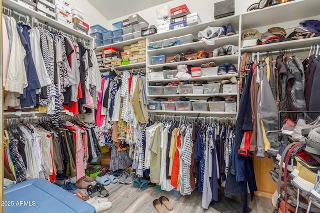 spacious closet with wood finished floors