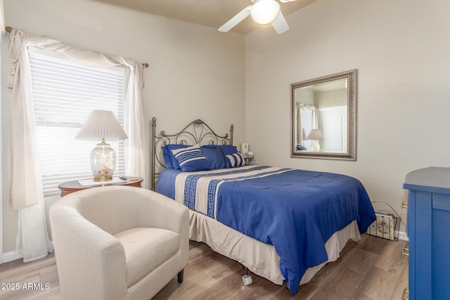 bedroom with wood finished floors and ceiling fan