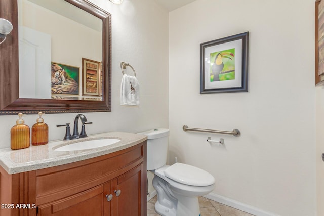 half bath featuring toilet, tile patterned flooring, vanity, and baseboards