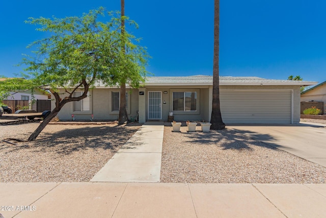 3447 E Dolphin Ave, Mesa, AZ 85204 - ranch-style home featuring a garage, driveway, and stucco siding