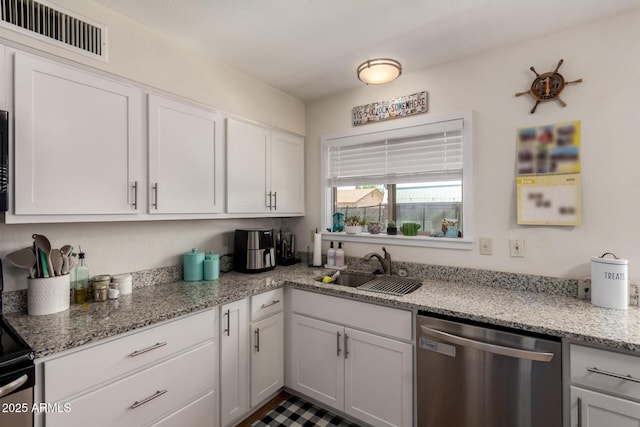 3447 E Dolphin Ave, Mesa, AZ 85204 - kitchen with stainless steel dishwasher, white cabinets, and light stone counters