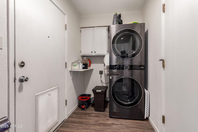 3447 E Dolphin Ave, Mesa, AZ 85204 - washroom with cabinet space, stacked washer / dryer, and wood finished floors