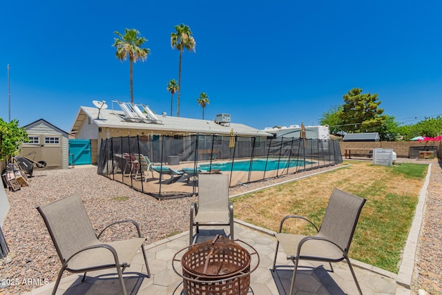 3447 E Dolphin Ave, Mesa, AZ 85204 - view of swimming pool with a fire pit, a patio, and a fenced backyard