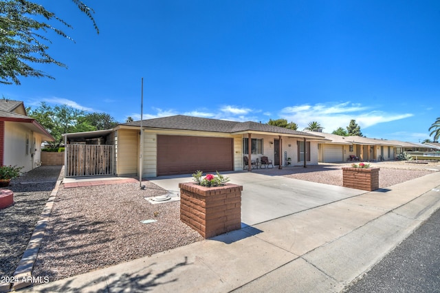 ranch-style house featuring a garage