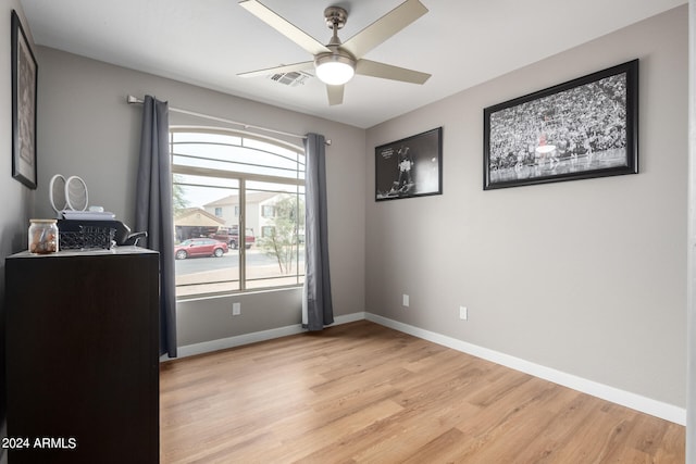 spare room featuring light hardwood / wood-style floors and ceiling fan