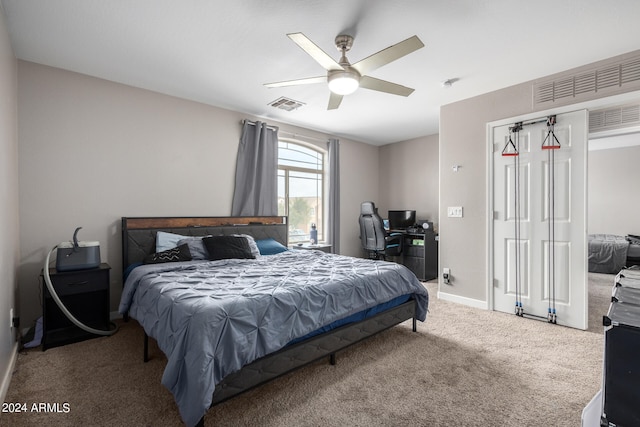 carpeted bedroom with ceiling fan