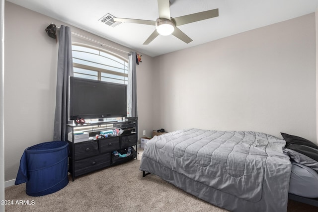 bedroom featuring ceiling fan and carpet