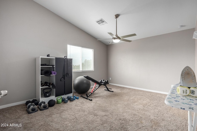 workout area featuring lofted ceiling, ceiling fan, and carpet flooring