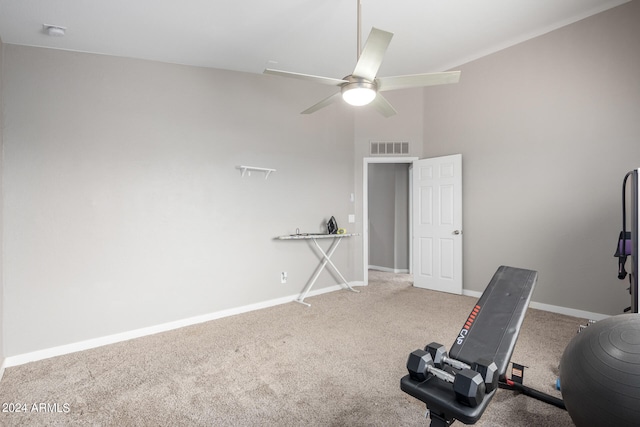 exercise area featuring ceiling fan and carpet floors