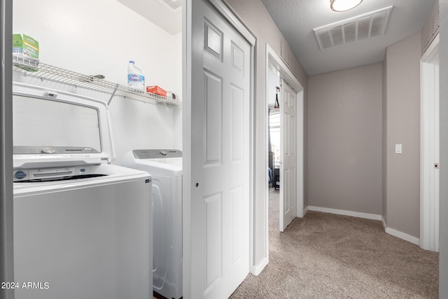 washroom featuring light colored carpet and independent washer and dryer