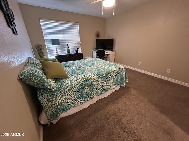 bedroom featuring baseboards, ceiling fan, and dark colored carpet