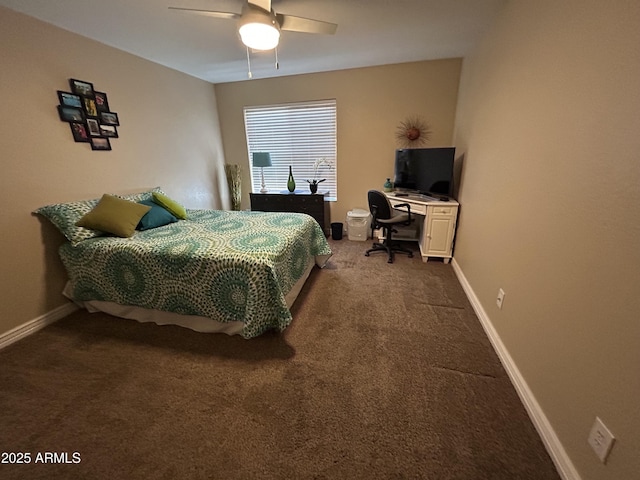 bedroom featuring dark colored carpet, a ceiling fan, and baseboards
