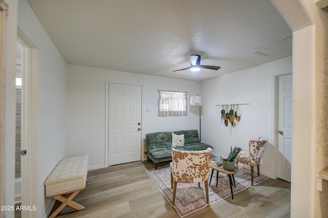 552 E 8th St, Florence, AZ 85132 - living area with ceiling fan, baseboards, and light wood-style floors
