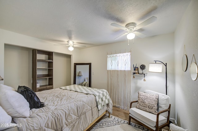 552 E 8th St, Florence, AZ 85132 - bedroom featuring a ceiling fan, a textured ceiling, and light wood-style floors