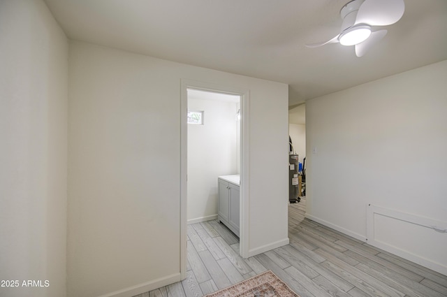 552 E 8th St, Florence, AZ 85132 - empty room featuring baseboards, ceiling fan, light wood-type flooring, and electric water heater