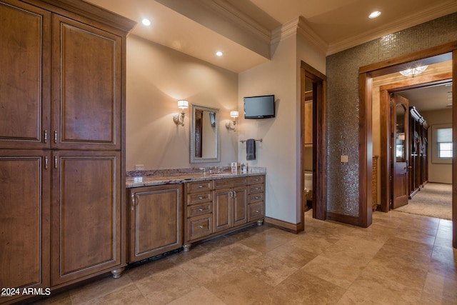 bathroom with vanity, tile flooring, toilet, and ornamental molding