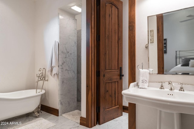 bathroom with a bath to relax in and tile floors