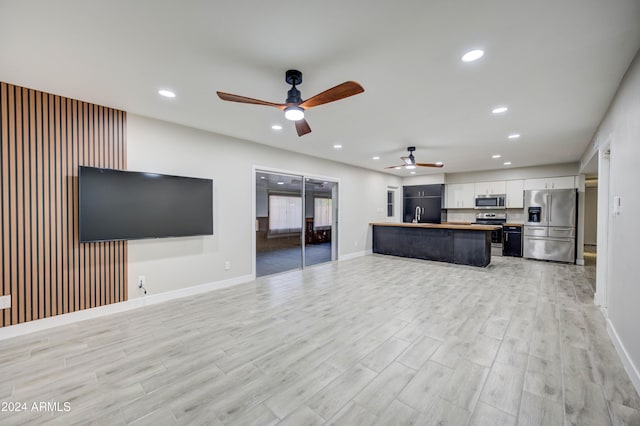 2122 E Radcliffe Dr, Tempe, AZ 85283 - unfurnished living room with ceiling fan, light wood-type flooring, and recessed lighting