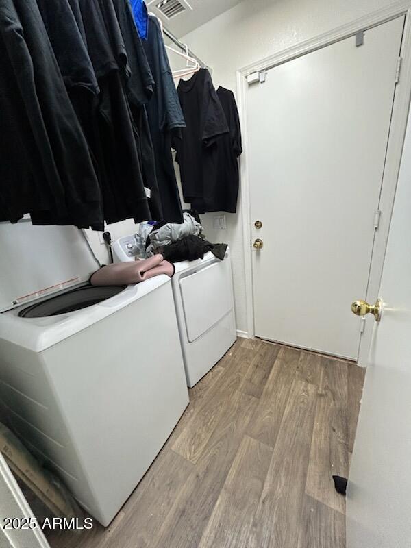 7664 W Vermont Ave, Glendale, AZ 85303 - washroom featuring independent washer and dryer and wood finished floors